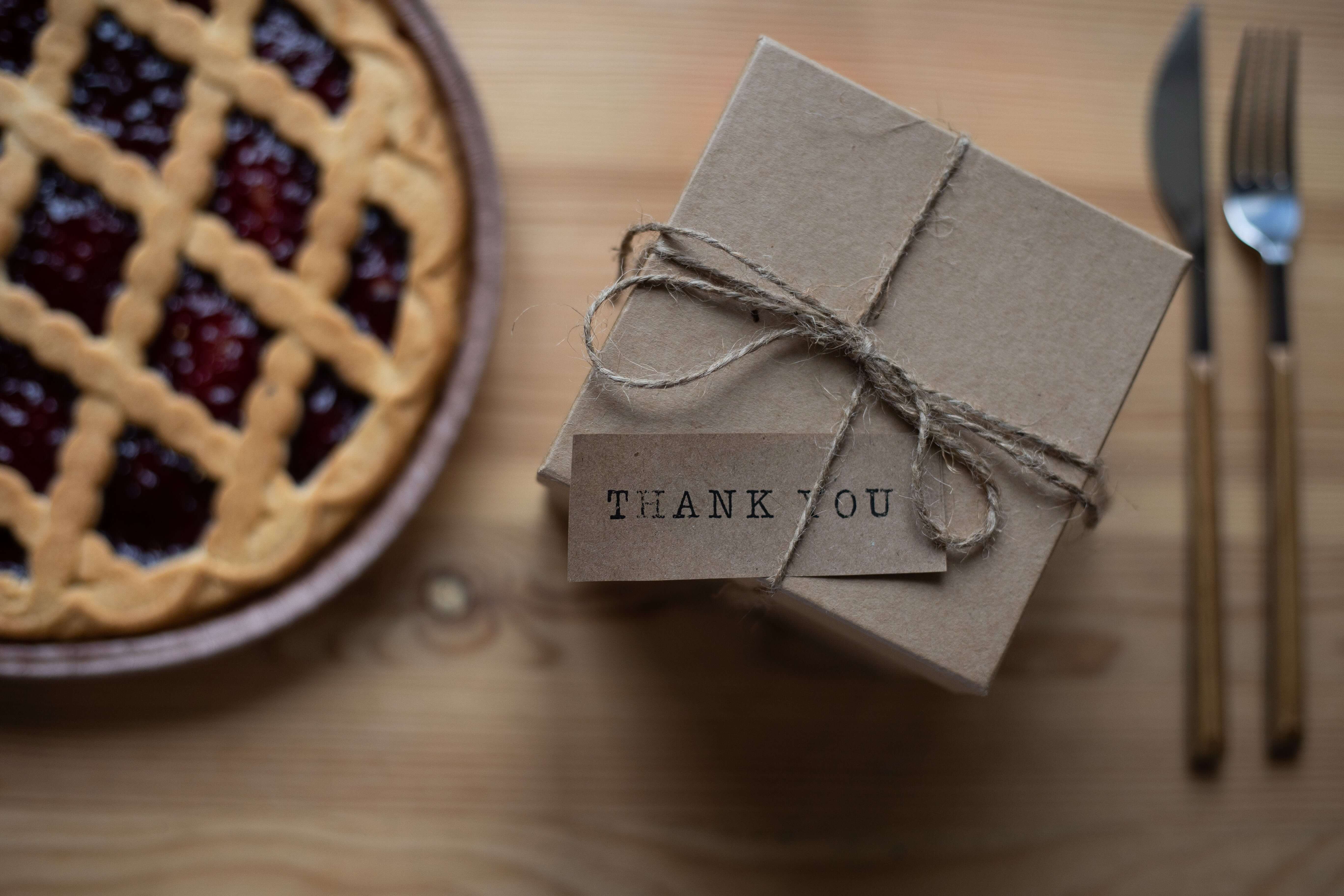 Reasons For Rewarding Your Employees With Gift on a table and a tart