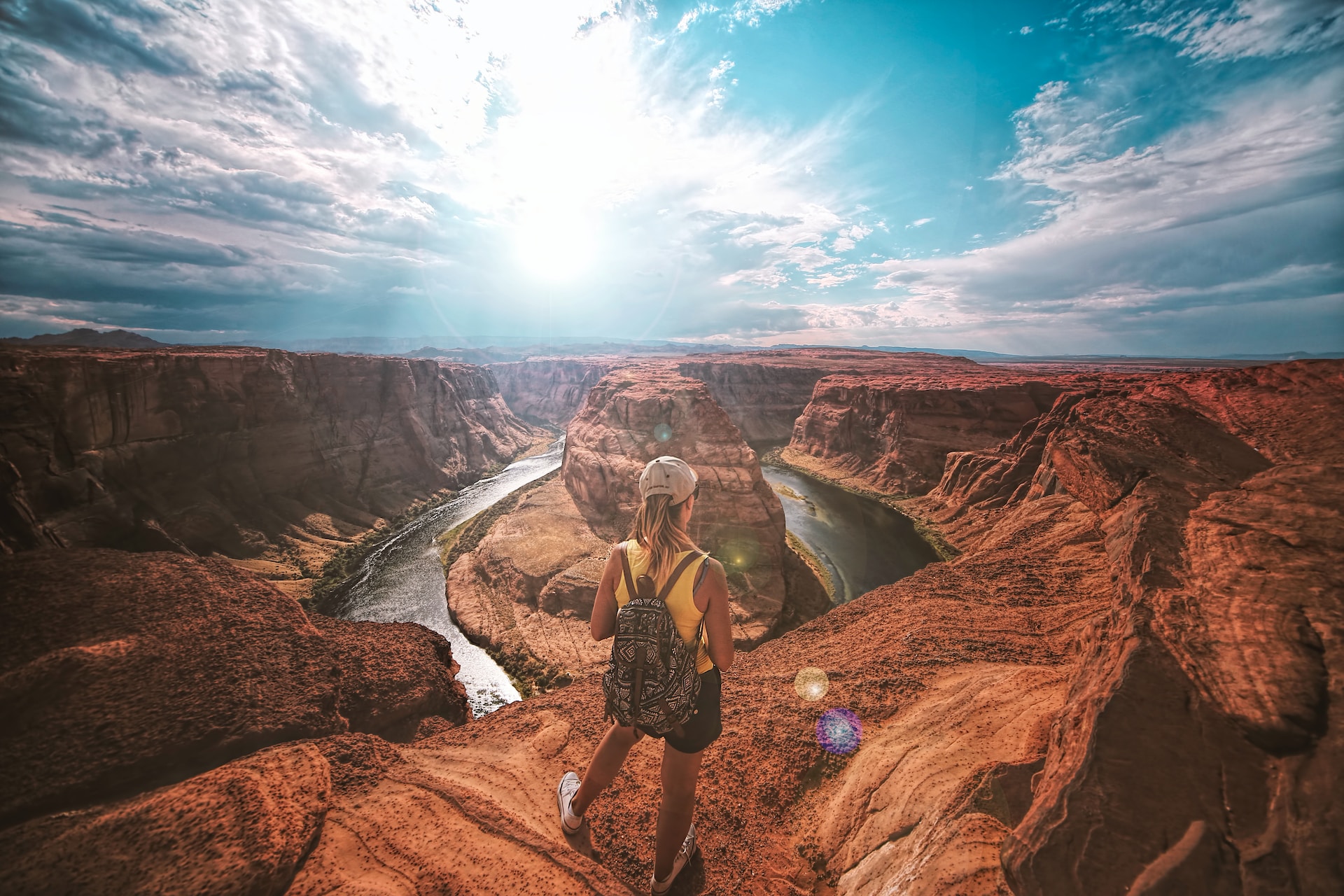 10 Trending Holiday Prizes: Boosting Brand Loyalty - Woman standing on top of canyon