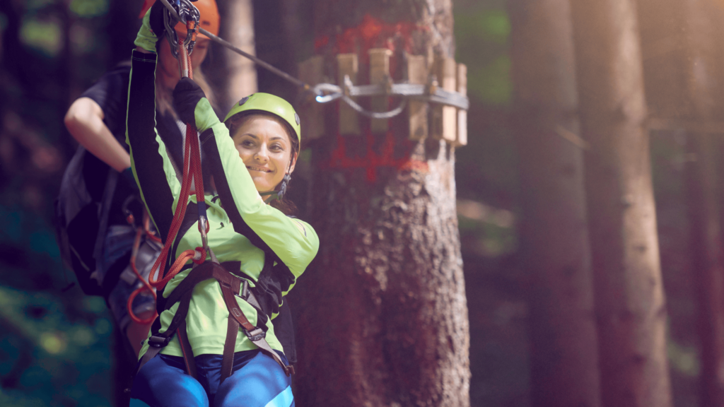zip lining corporate outdoor activities in the woods