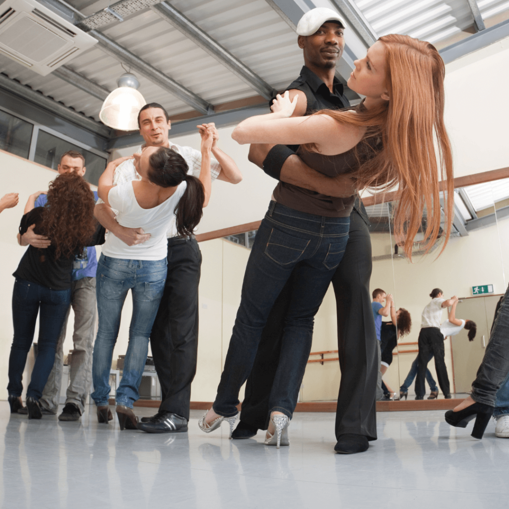 dance class with male and female pairs dancing