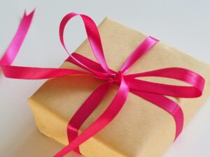 Incentive gift Brown gift box with pink ribbon